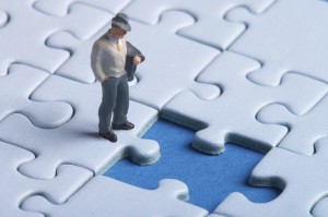 plastic figure standing in front of a hole in a puzzle